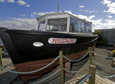 A side view of the Persephone boat at it's old location in Gibsons