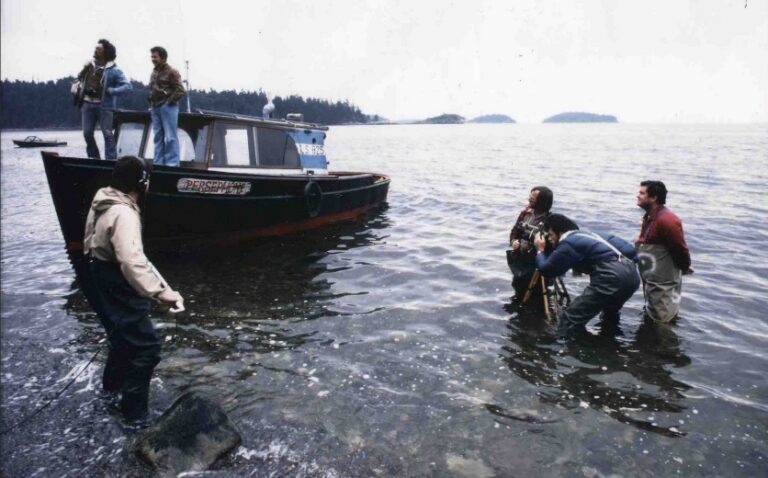 The Beachcombers CBC production still, from episode “Tray Tree” featuring Dr. David Suzuki, pictured on the bow of the boat with Bruno Gerussi.